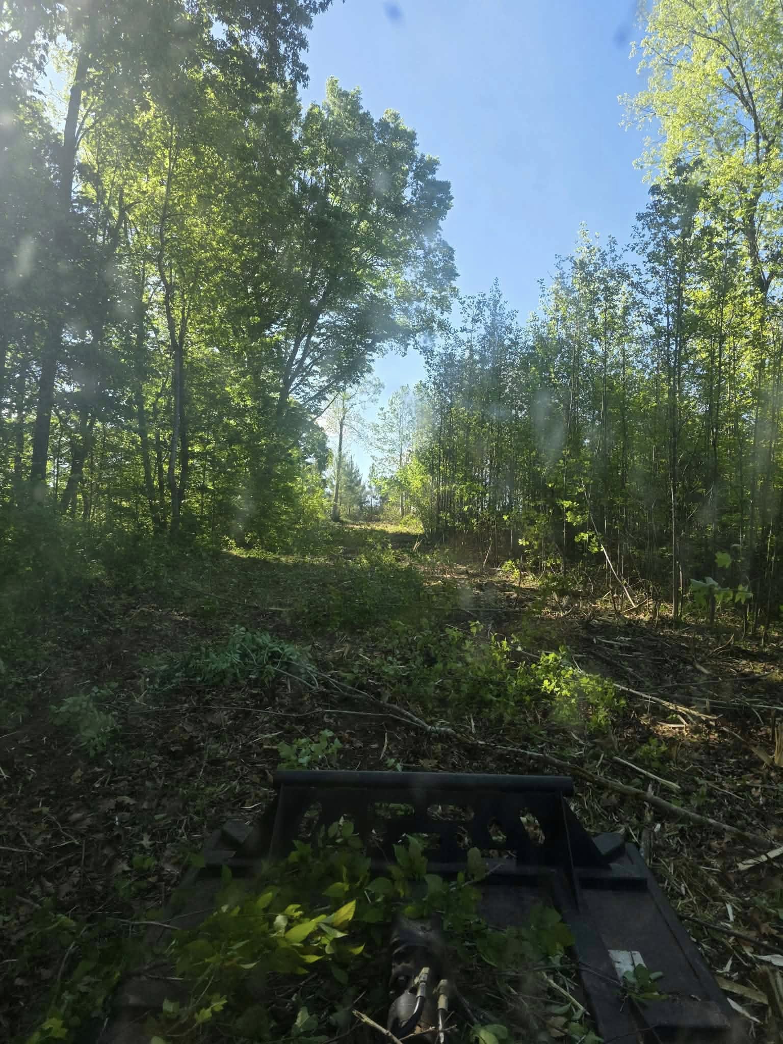 Bushogging equipment in action